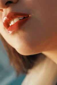 laser lip plumping represented by a woman's painted lips
